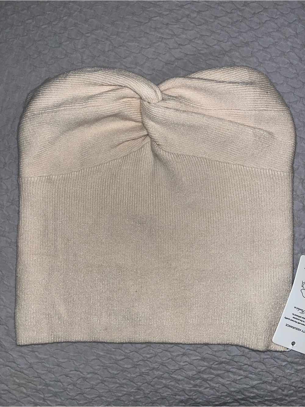 Cream colored ribbed strapless top